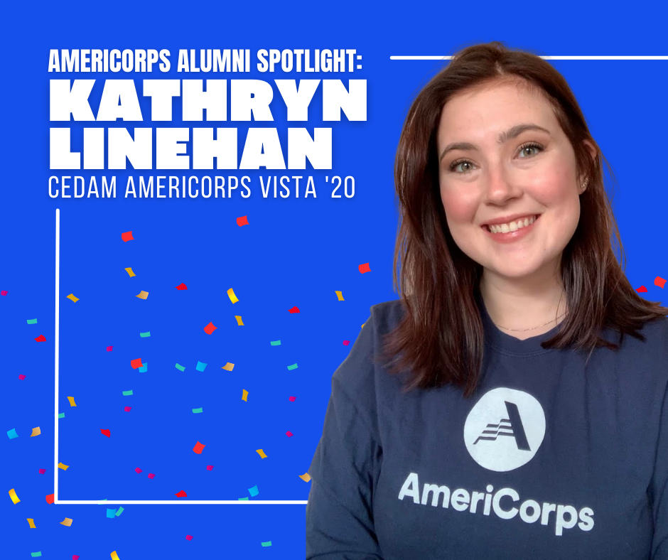Woman (Kathryn) smiling in a blue AmeriCorps shirt