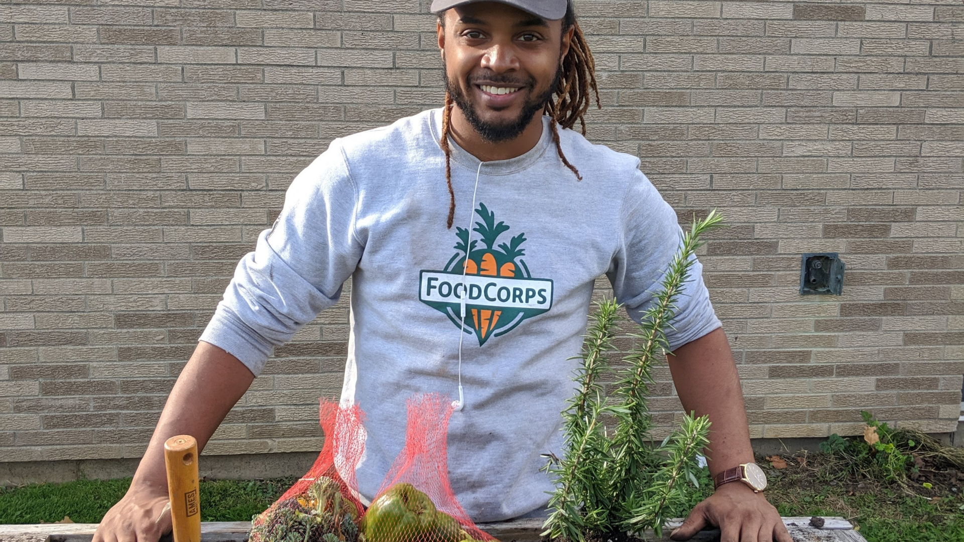 Man in front of garden box