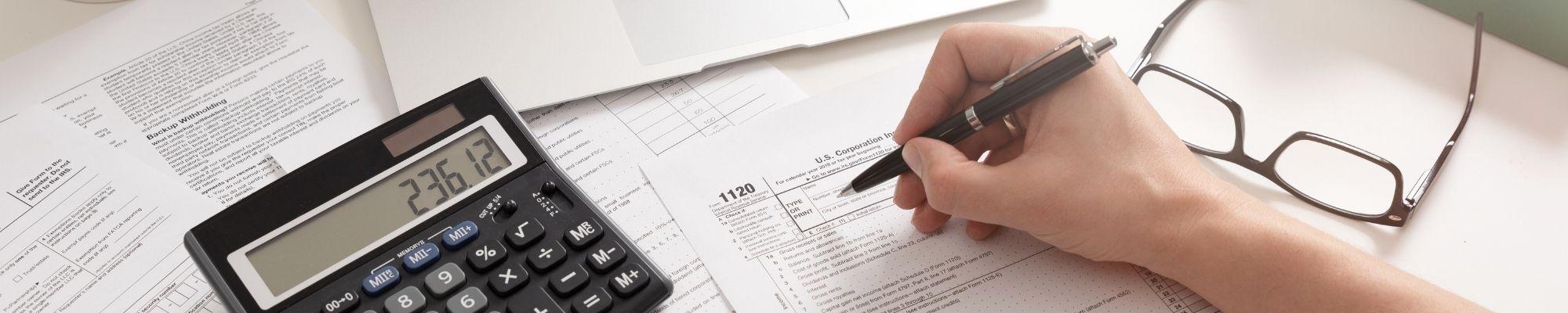 Photo of tax paperwork and calculator
